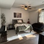 minimalist masculine bedroom with musical vibes, neutral earth tones color palette
