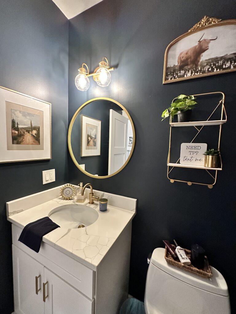 Beautiful moody blue bathroom; farmhouse refresh with gallery wall; gold accents