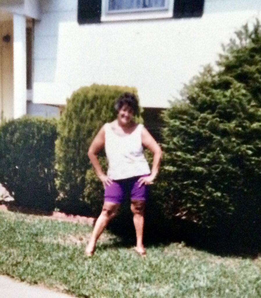 Sassy Grandma, posing on the lawn- late 1970's in shorts and tank blouses with hands on hips