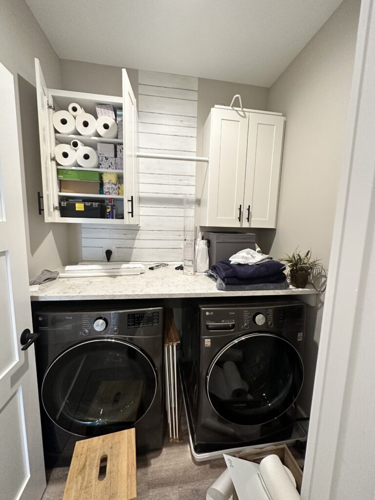 In progress farmhouse laundry room with shiplap partially done