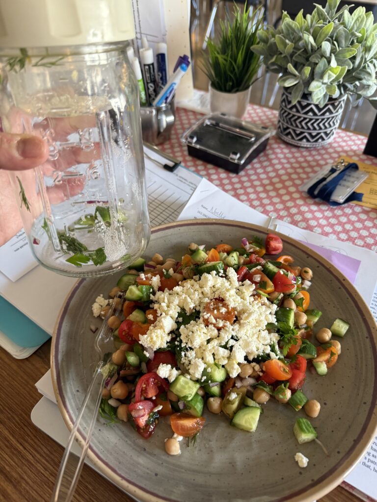 Mediterranean salad on plate at teacher work desk